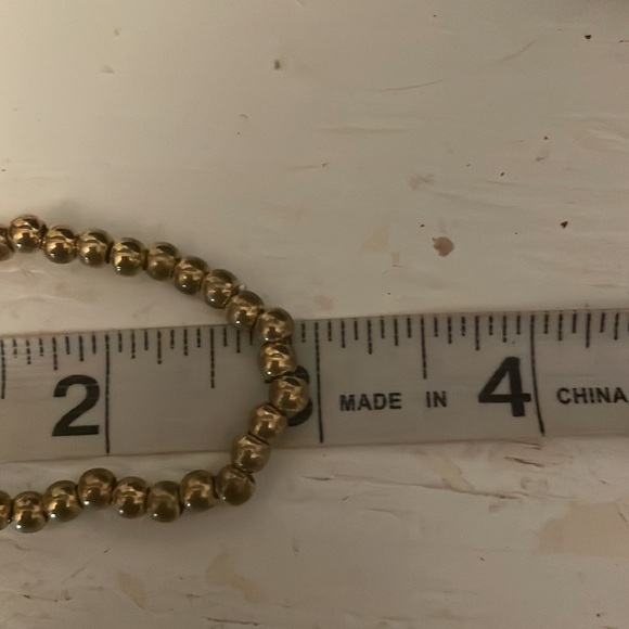 6” golden beaded stackable stretch bracelet with Eiffel Tower pendant & 39 beads - Picture 9 of 11